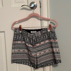 Pink, black, and cream colored shorts